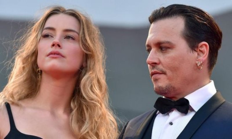 Photo of Johnny Depp and Amber Heard settle divorce